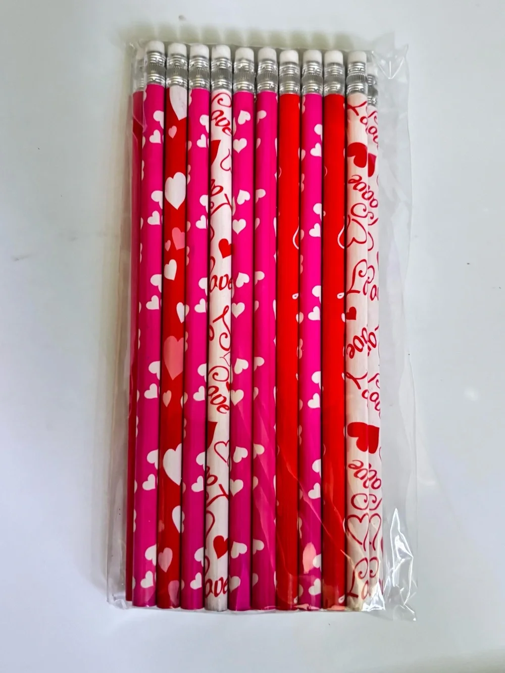 11 Valentine's Day pencils with white hearts and 'I love you' text #valentines